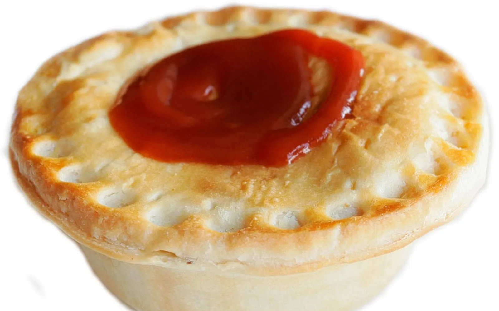 An Australian meat pie with crisp golden layered pastry, minced meat and thick gravy spilling out from inside