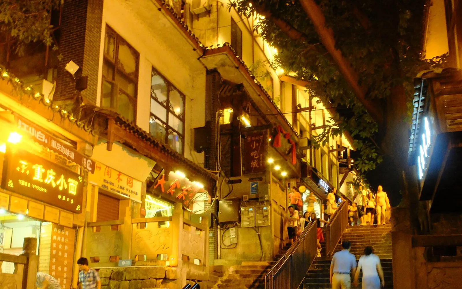 A narrow alley lined with ancient wooden buildings in Chongqing's Ciqikou Ancient Town