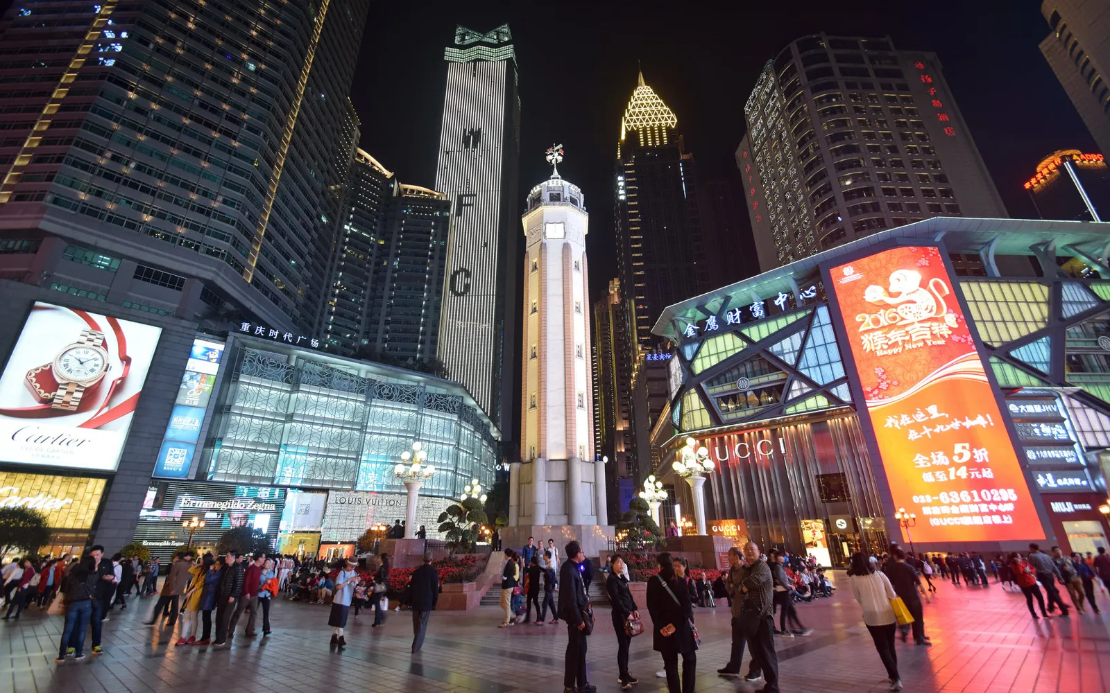 The white Jiefangbei Monument standing tall in Chongqing's CBD at night