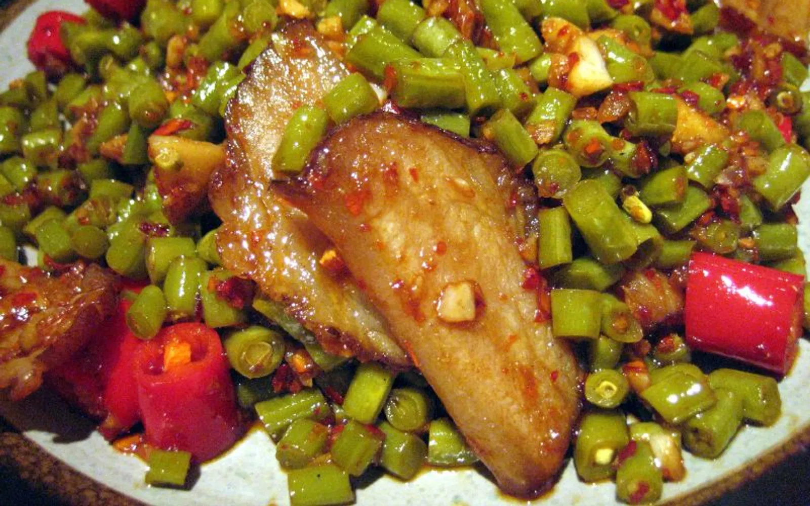 Sticky-rice blood duck (xueba yazi), Fenghuang's signature dish, deep brown and fiery
