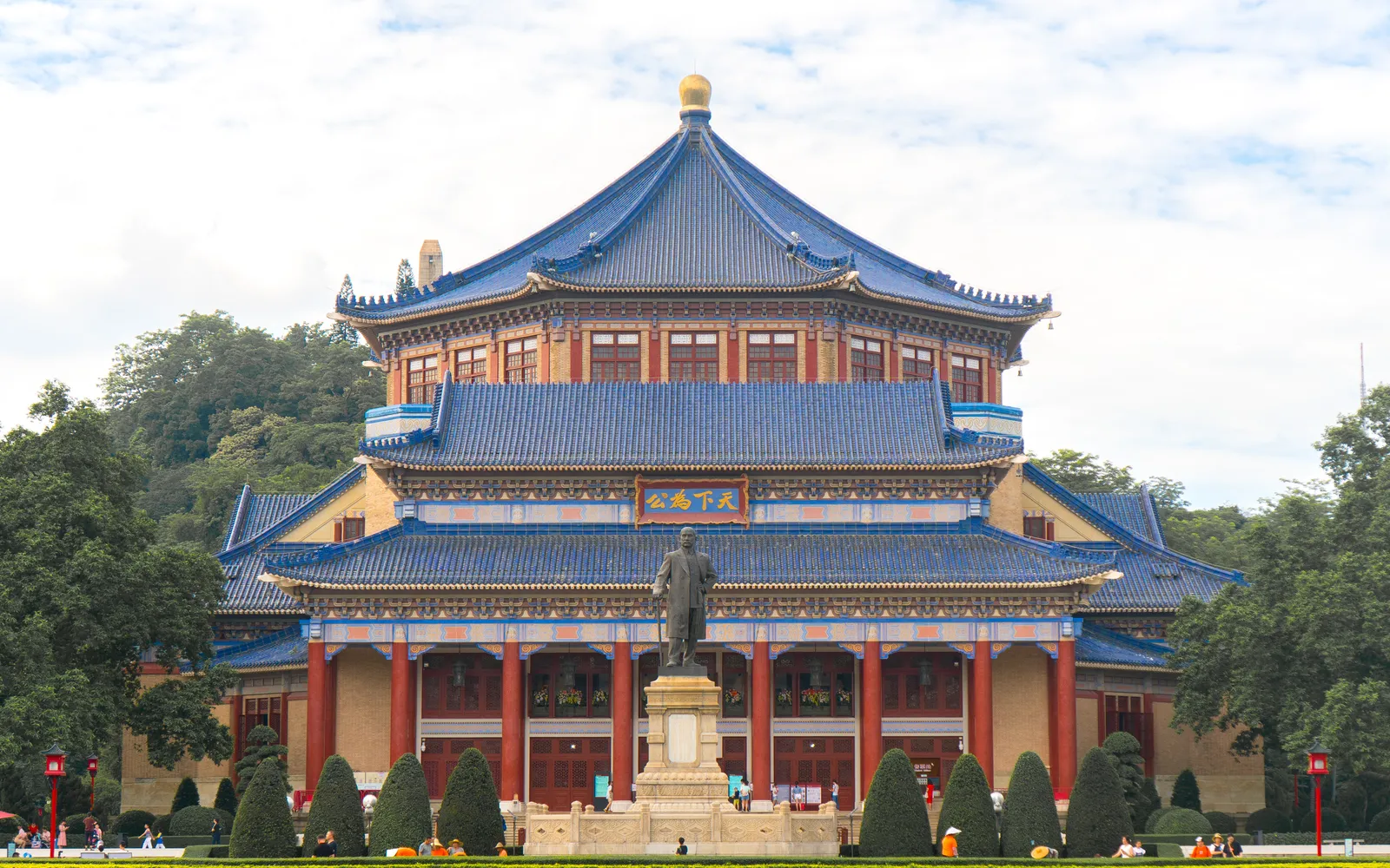 The octagonal Sun Yat-sen Memorial Hall with its bright blue roof standing against the sky in Guangzhou