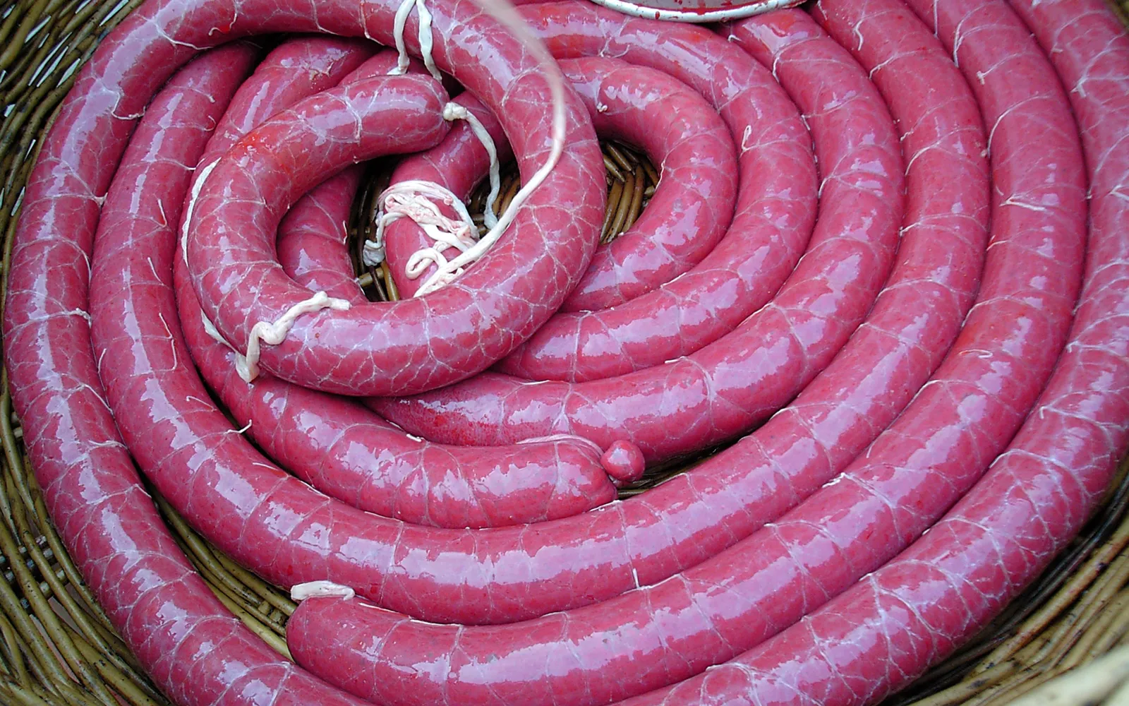 Grilled, sliced Naxi blood sausage on a plate, Lijiang Old Town