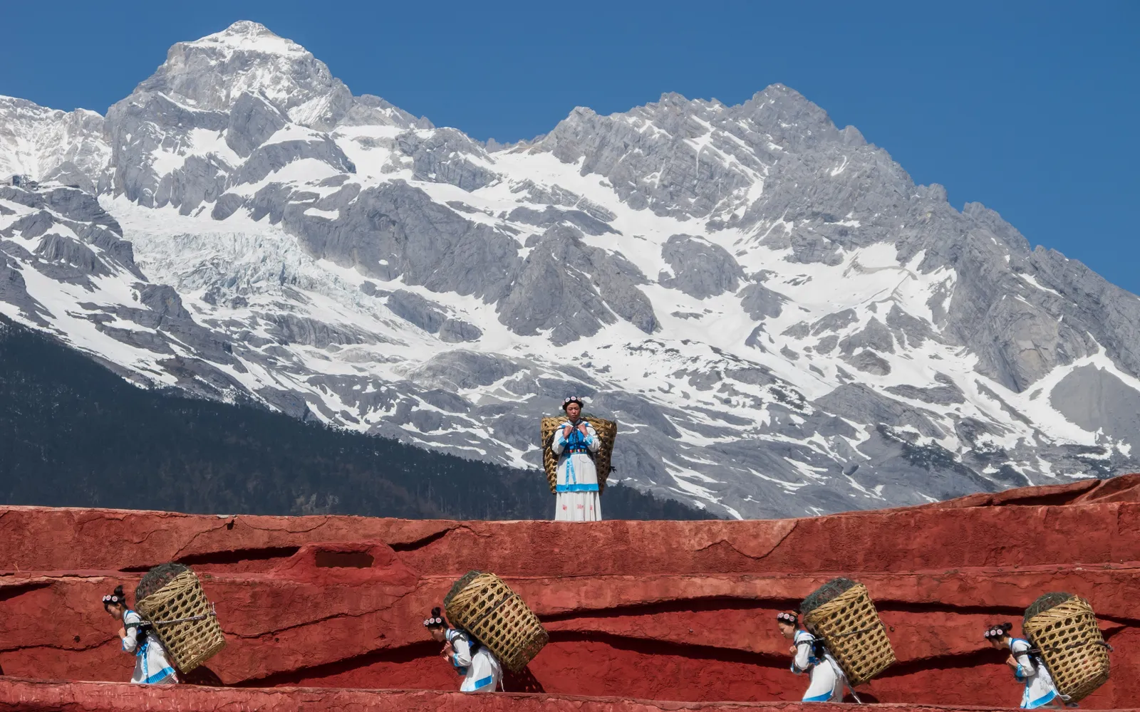 A Sanhesui ceremonial table set of the Naxi people, Lijiang, with many dishes arranged in tiers
