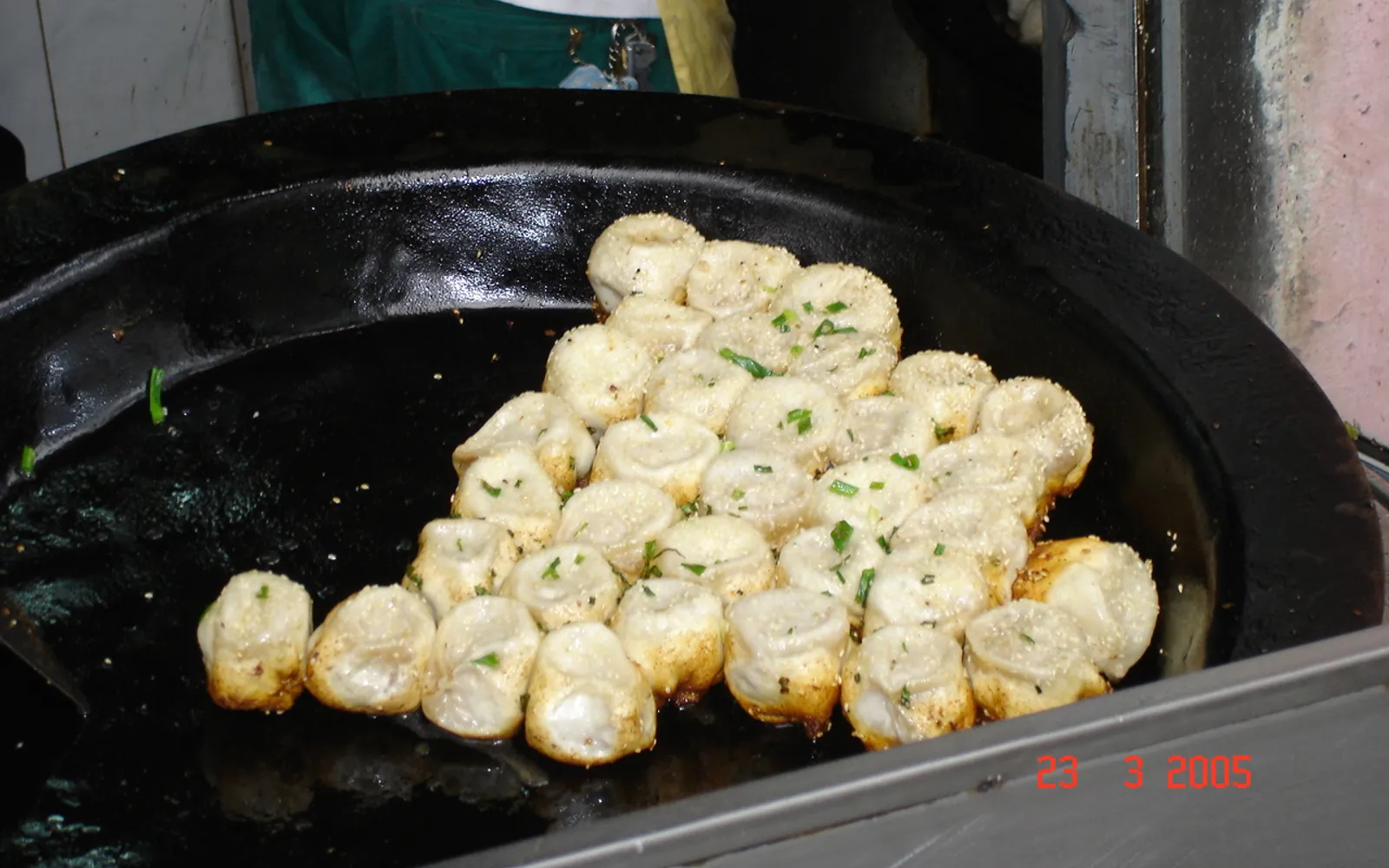 Crisp, fragrant pan-fried beef dumplings served in a skillet