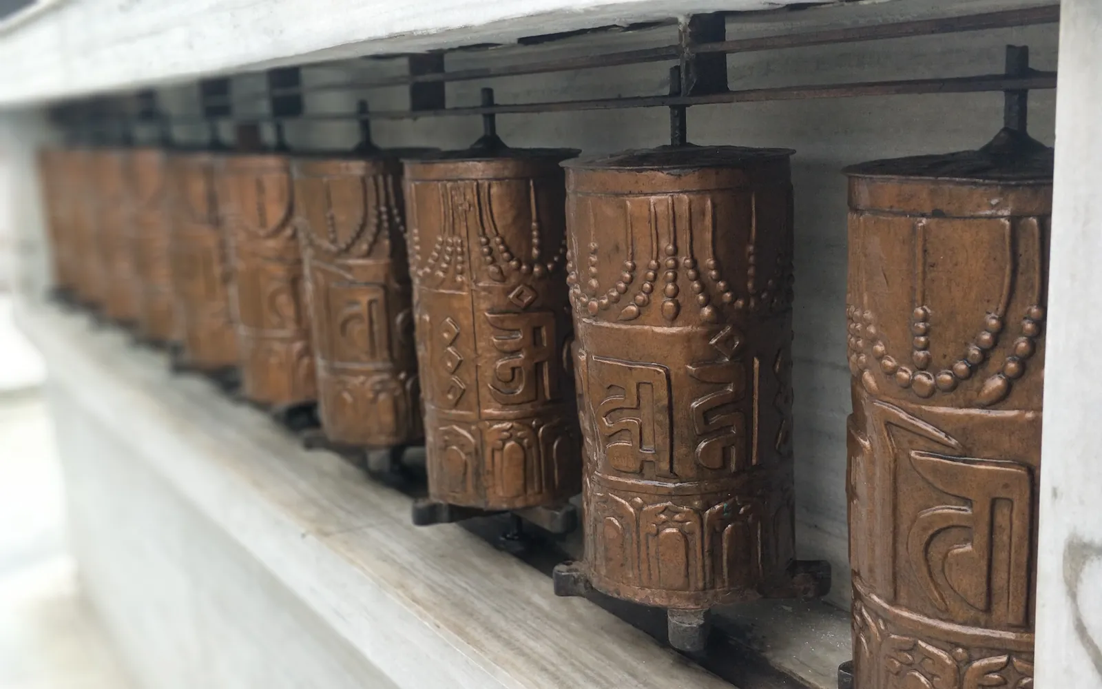 A 21-metre-tall golden giant prayer wheel stands on the hilltop above Shangri-La