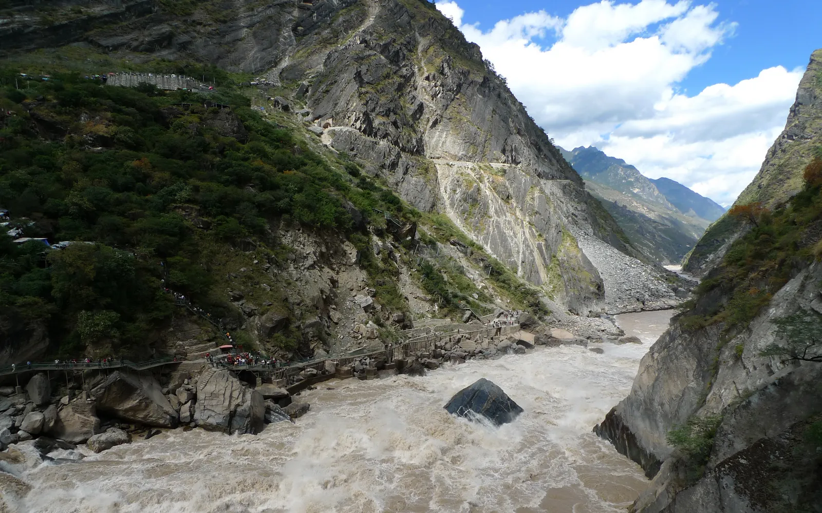 The sheer cliffs of Tiger Leaping Gorge between Haba and Jade Dragon peaks, with fast-flowing green water below