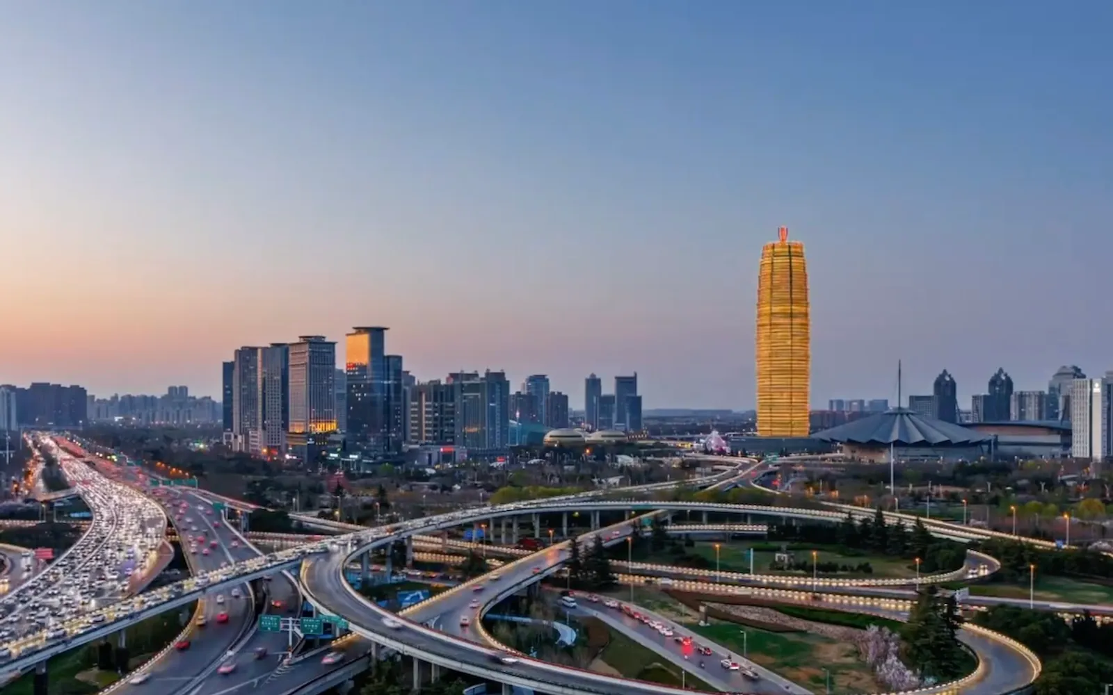 The ancient rammed-earth walls of the Shang capital — reddish-brown and still 5 to 10 metres tall in places — running through the middle of modern Zhengzhou
