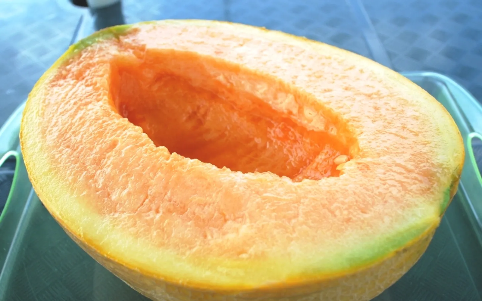 Furano melon sliced open to reveal vibrant orange flesh, Hokkaido