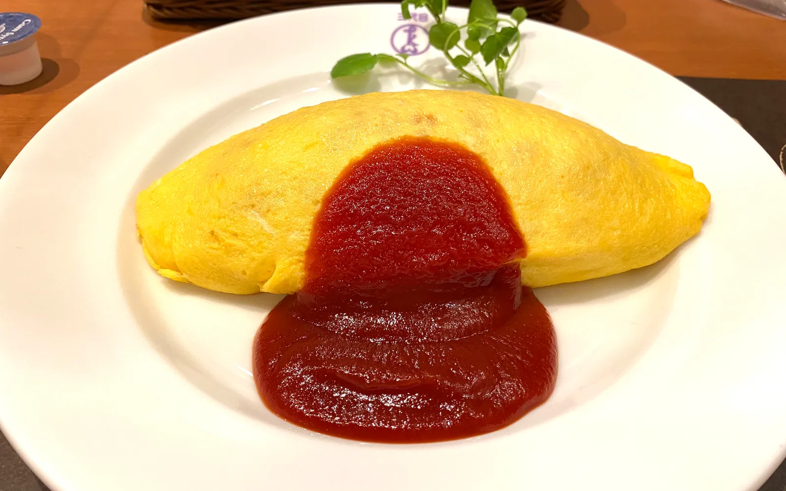 Furano omu-kare — a soft egg omelette wrapped around rice and topped with local-vegetable curry