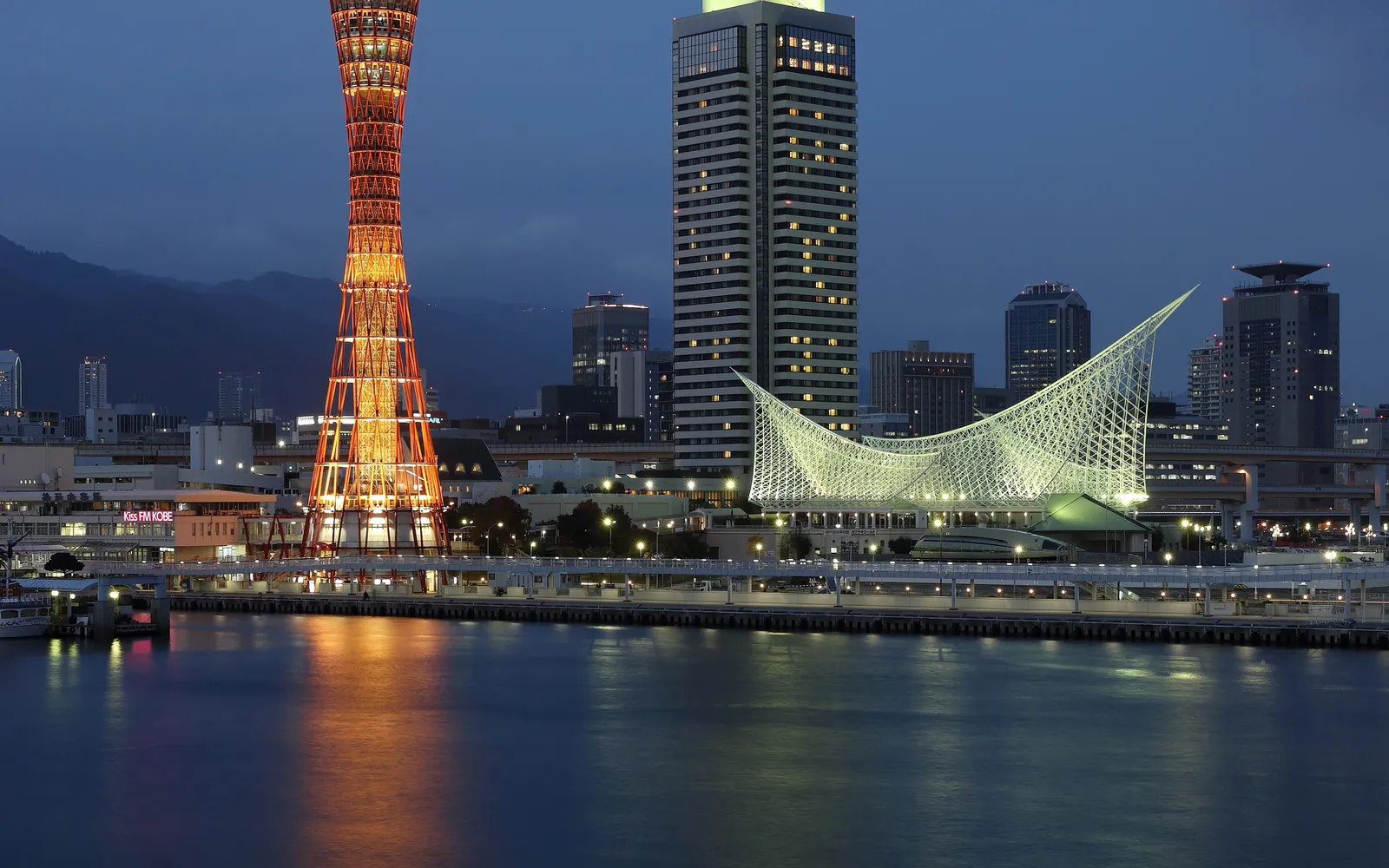 The umie MOSAIC shopping complex along the Kobe waterfront illuminated at night in colourful lights