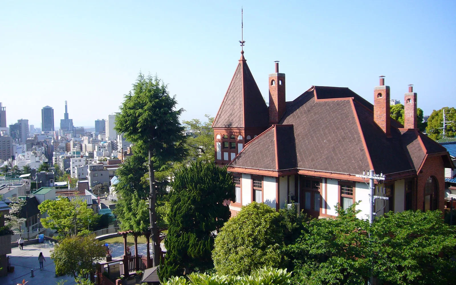 Colourful Victorian-style houses on the Kitano hillside in Kobe, set among green gardens