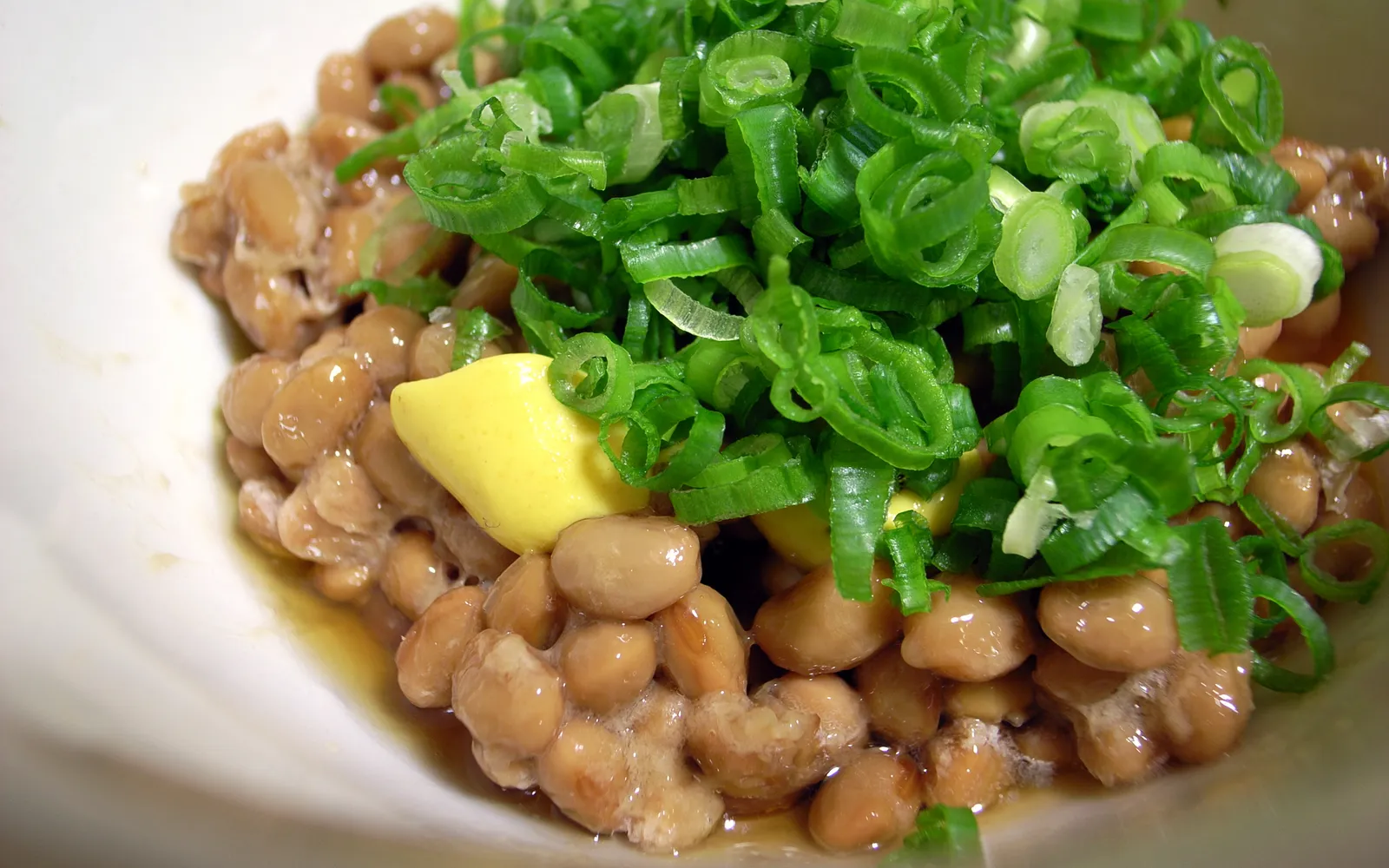 Karashi renkon mustard-miso stuffed lotus root, deep-fried and sliced into rounds