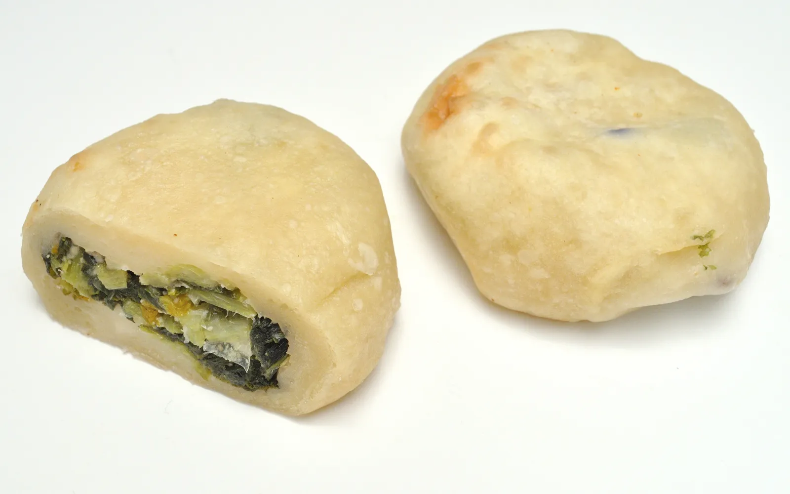 Soft-dough oyaki stuffed with vegetables and red bean, grilling over charcoal outside a Nagano shop
