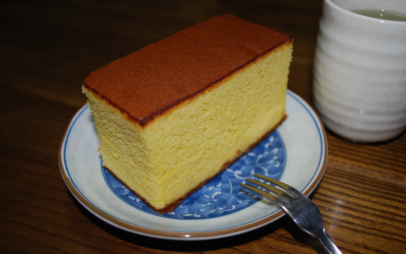 A sliced loaf of Nagasaki Castella — golden-yellow sponge cake with a moist, tender crumb