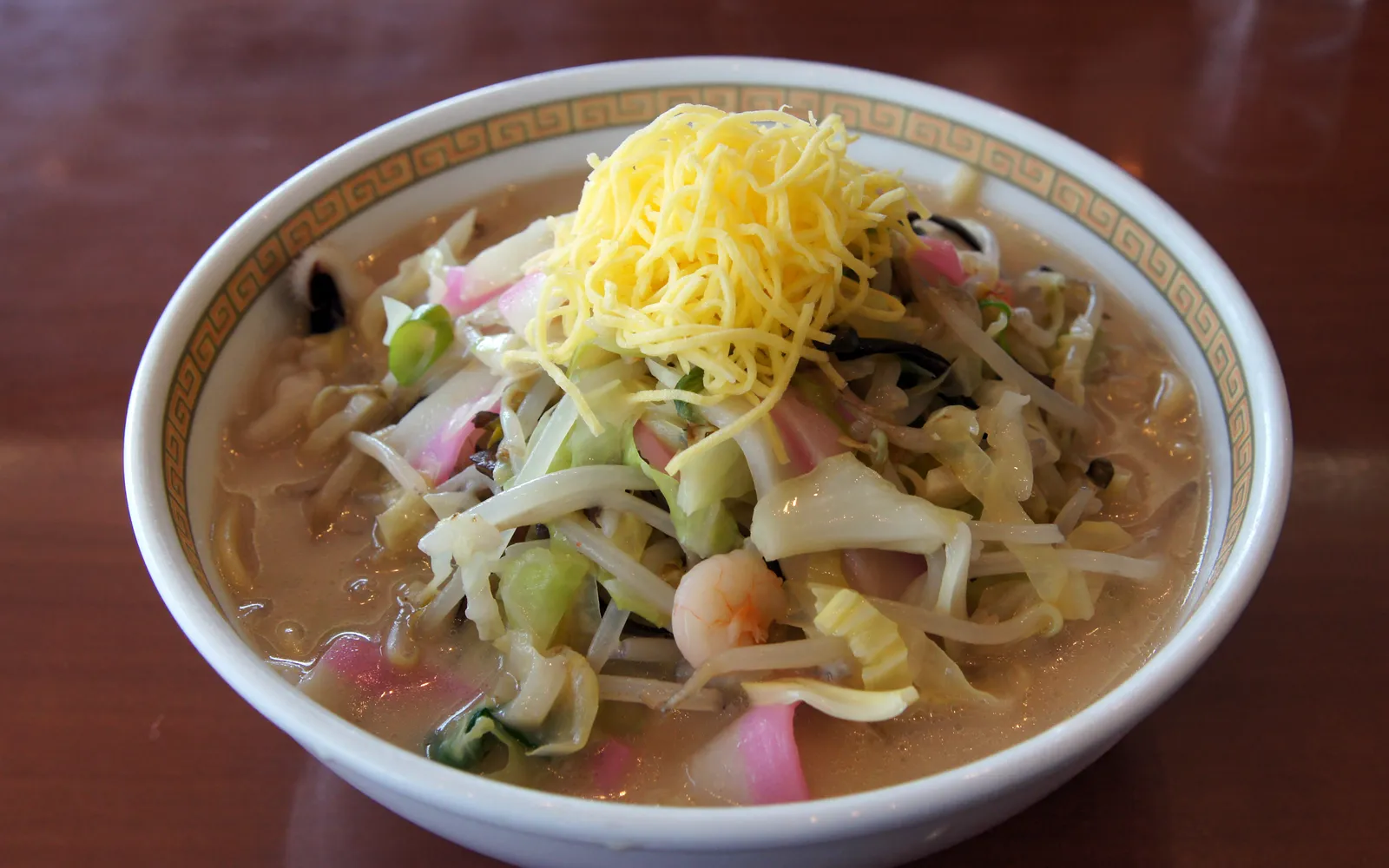 A bowl of Nagasaki Champon — thick noodles in a rich, cloudy broth loaded with seafood and vegetables