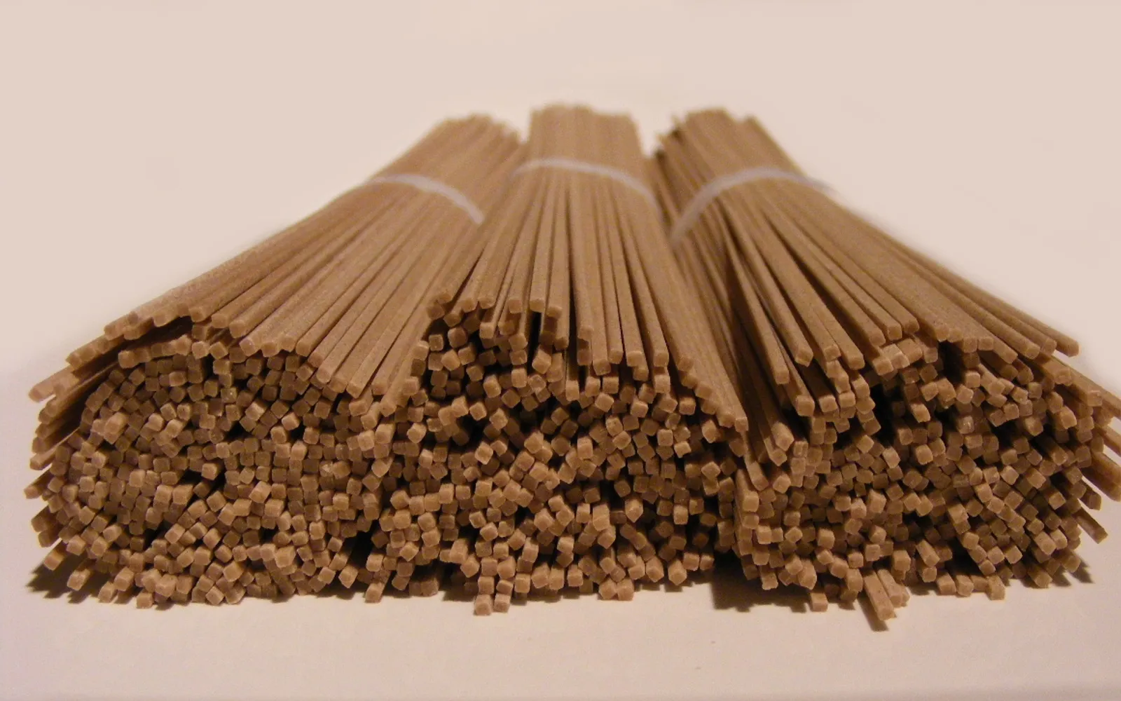 Fresh grey-brown soba noodles served cold with dashi dipping sauce and freshly grated wasabi