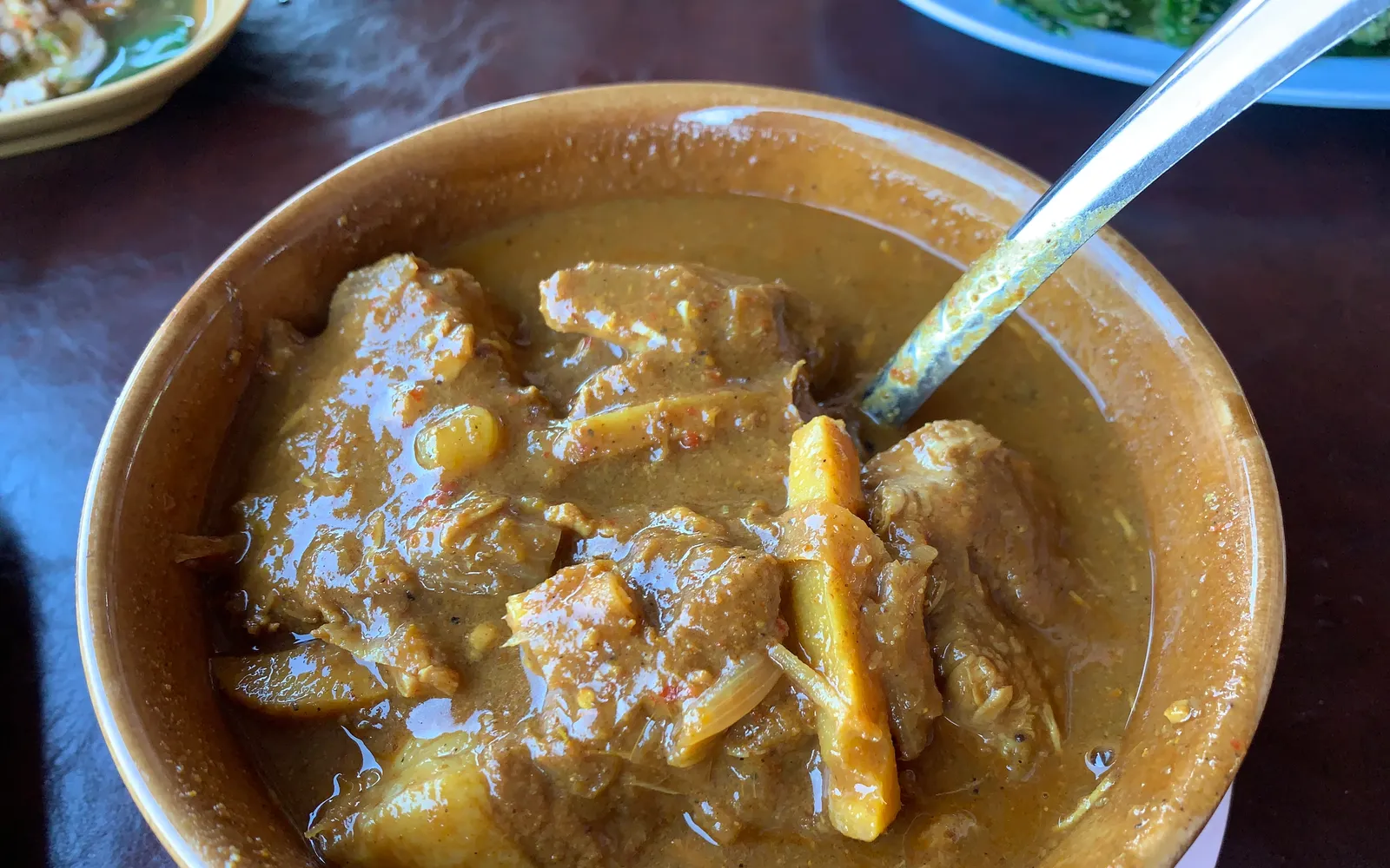 Gaeng Hang Le — deep-brown pork belly braised with Burmese spices, ginger, and pickled garlic