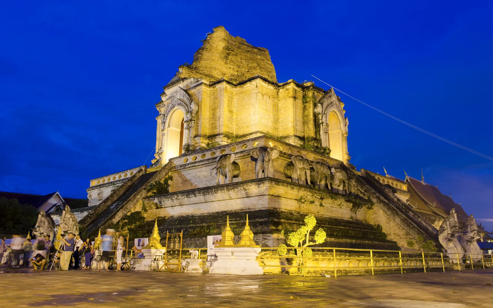 The massive 600-year-old chedi of Wat Chedi Luang in Chiang Mai's old city at dusk