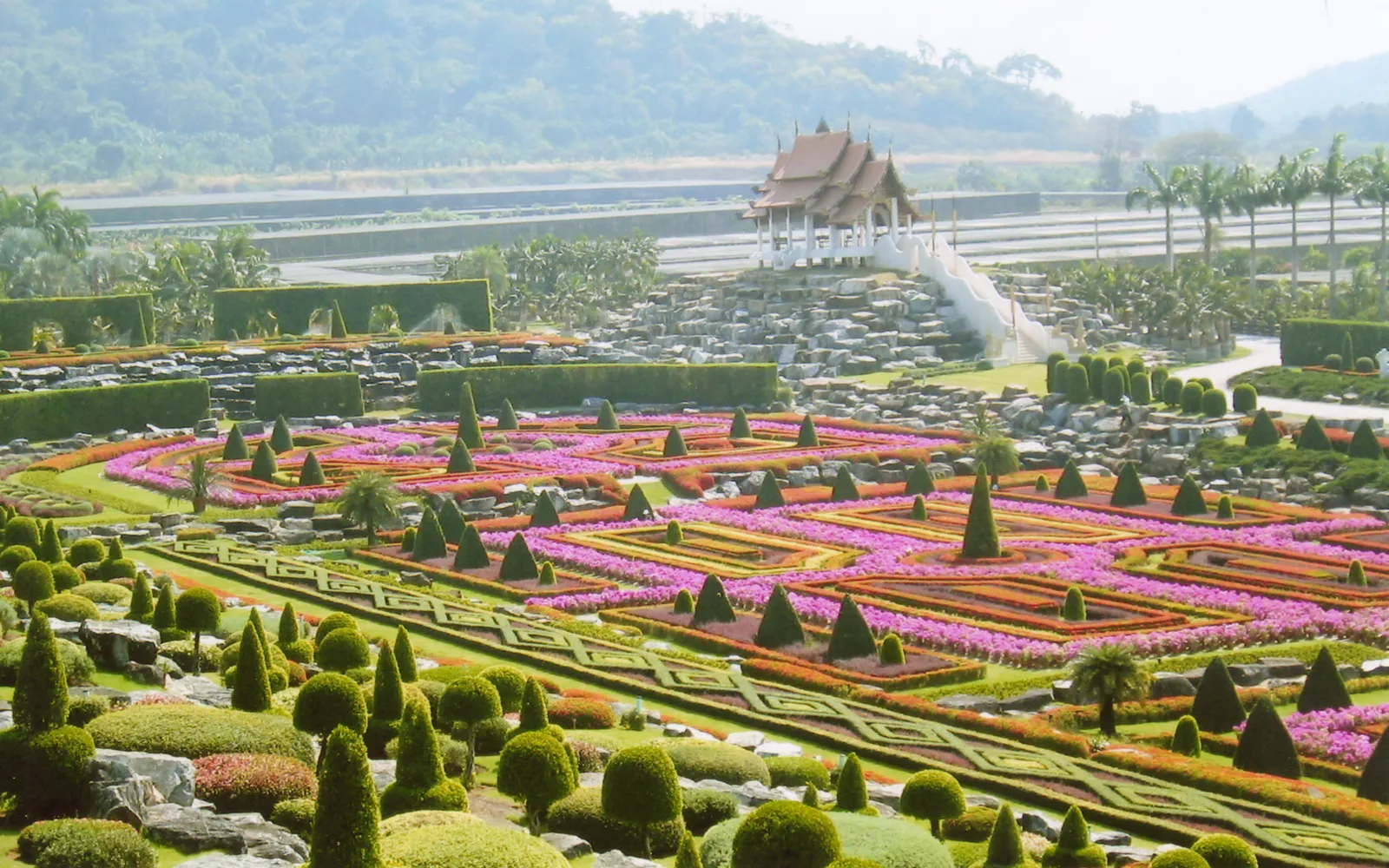 Nong Nooch Garden in Pattaya — a 500-acre tropical botanical garden featuring geometrically trimmed French gardens and the world's largest palm garden