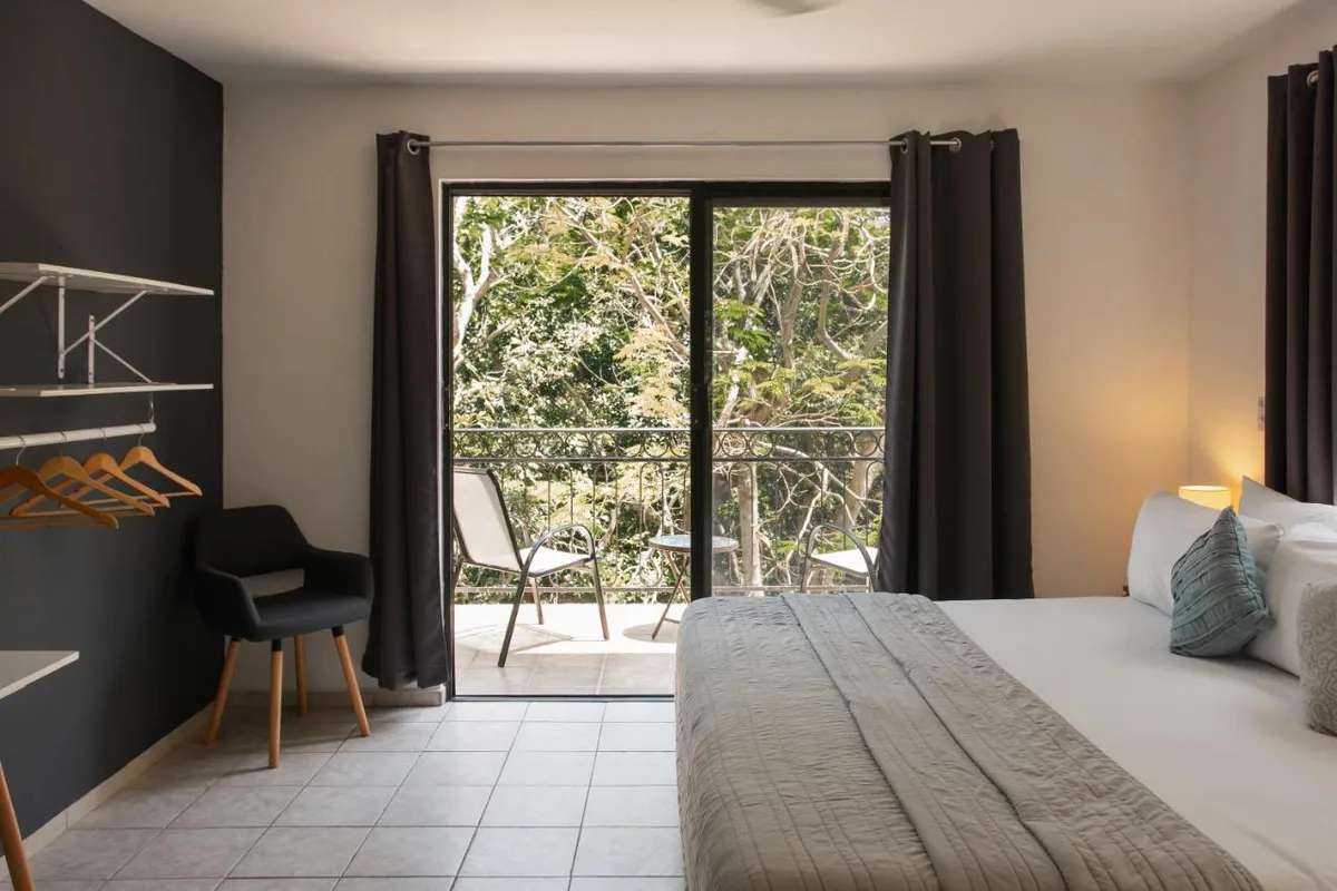 Che Suites Playa — ภาพห้องพักและบรรยากาศ