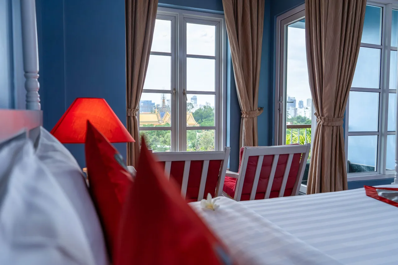 The Frangipani Royal Palace Hotel — rooms and atmosphere