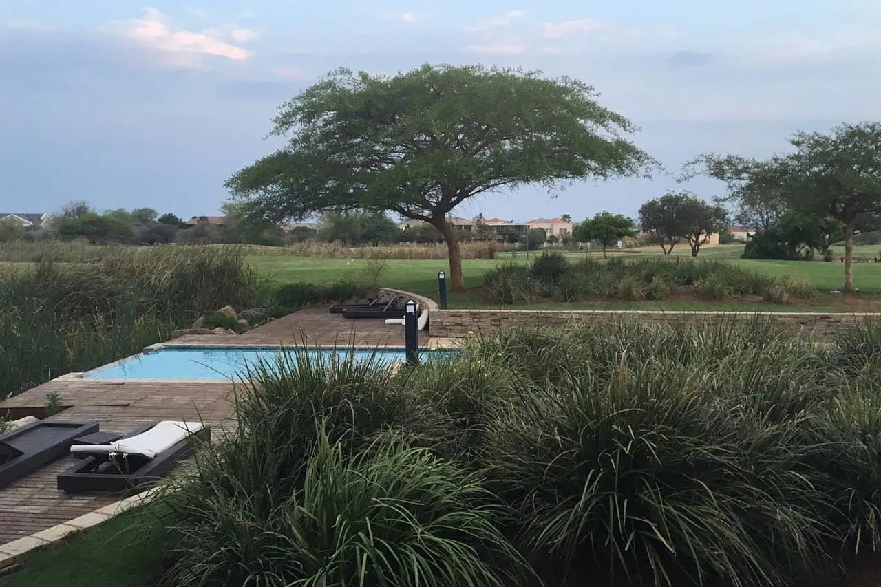 Phakalane Golf Estate Hotel Resort — rooms and atmosphere