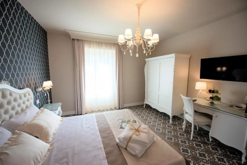Sui Generis Tropea Luxury Rooms — ภาพห้องพักและบรรยากาศ