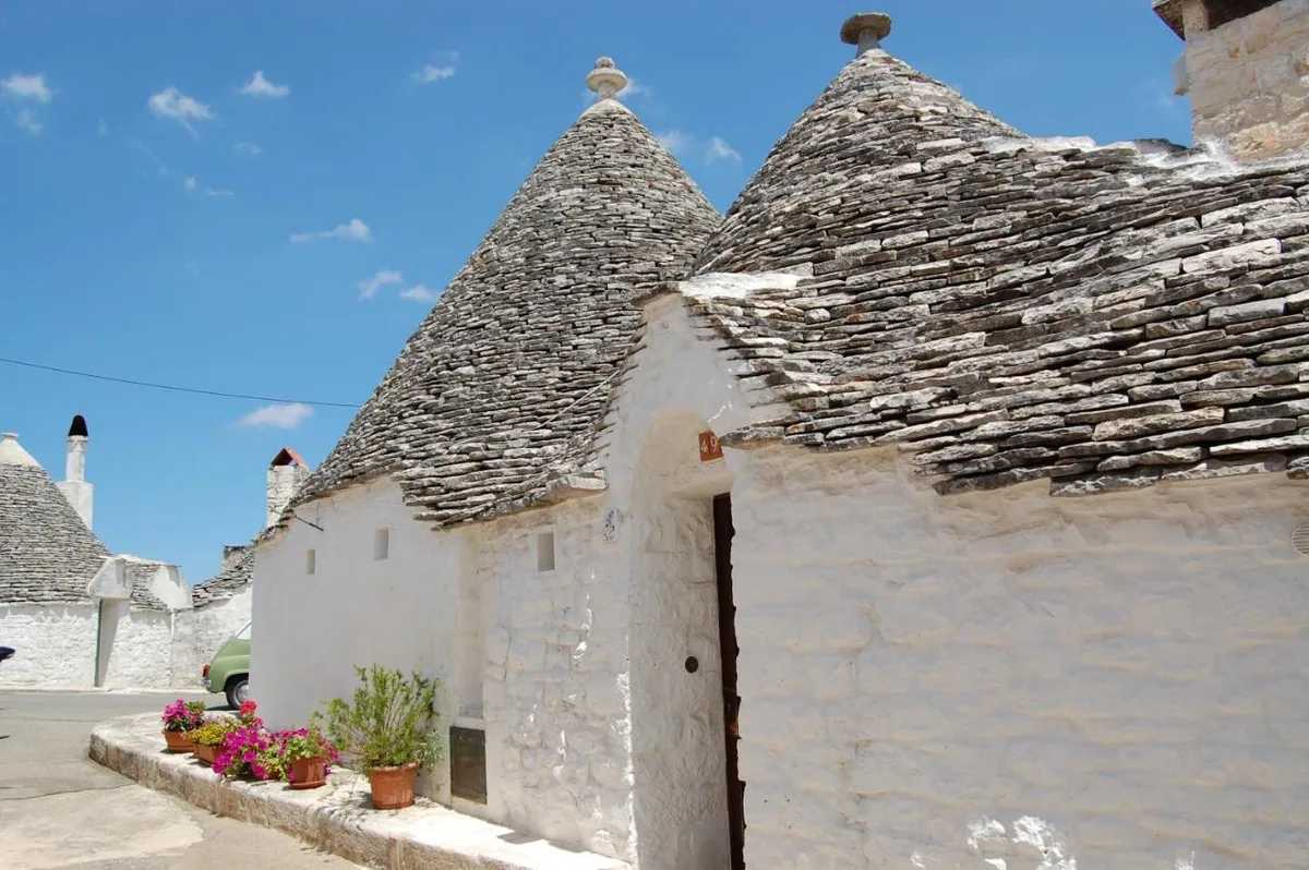 Trulli Holiday Albergo Diffuso — ภาพห้องพักและบรรยากาศ